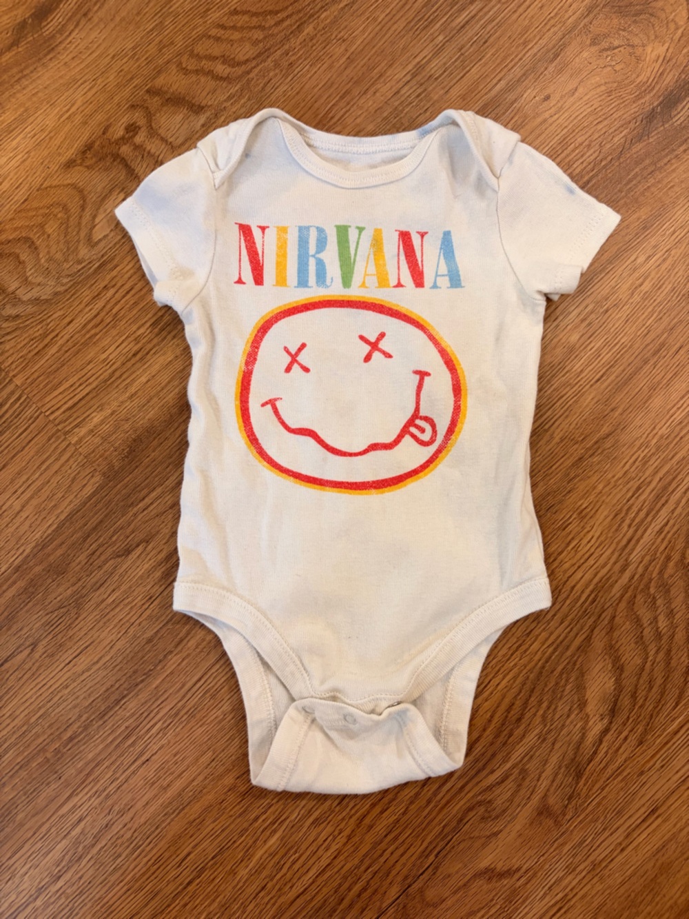 Nirvana Baby One-Piece Bodysuit in White with Multicolor Logo